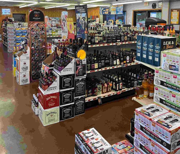 Whiskey aisle and hard seltzer selection inside AJ's Beer, Wine & Spirits